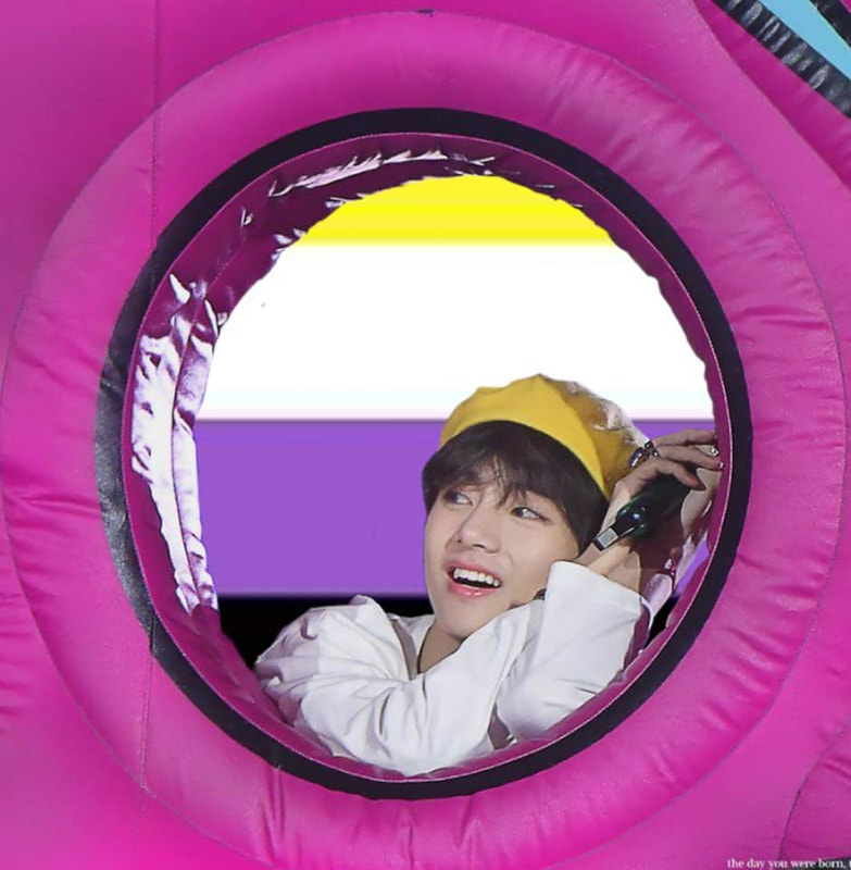 taehyung leaning into an inflated hole with the background being the nonbinary flag