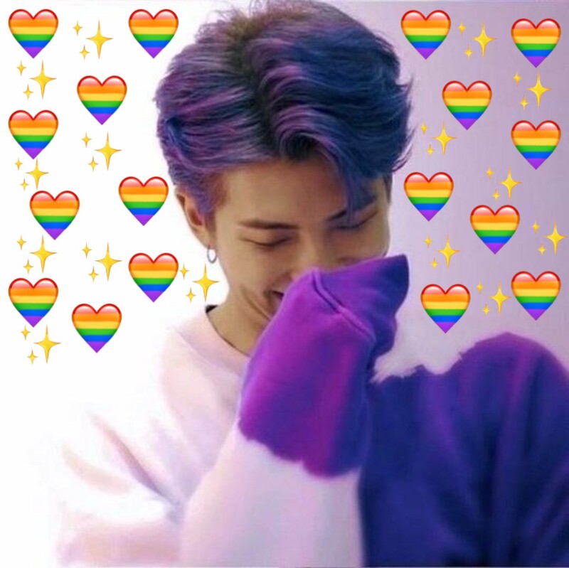 Namjoon covering his face in purple hair with his purple sleeve and rainbow heart emojis and sparkle emojis surrounding him. 