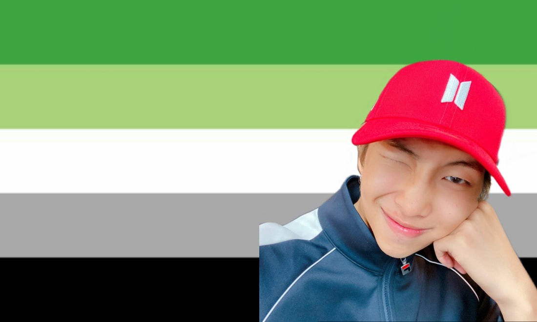 a cutout of a namjoon selca where he has a red hat with the bts logo over the aromantic flag