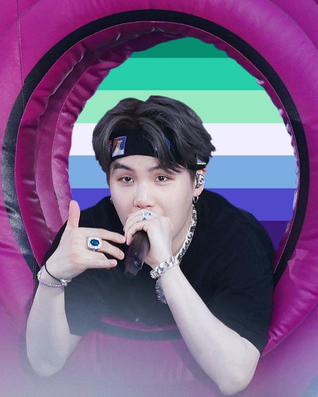 a cutout of yoongi rapping through an inflatable circle with the background of the circle being the ocean gay flag